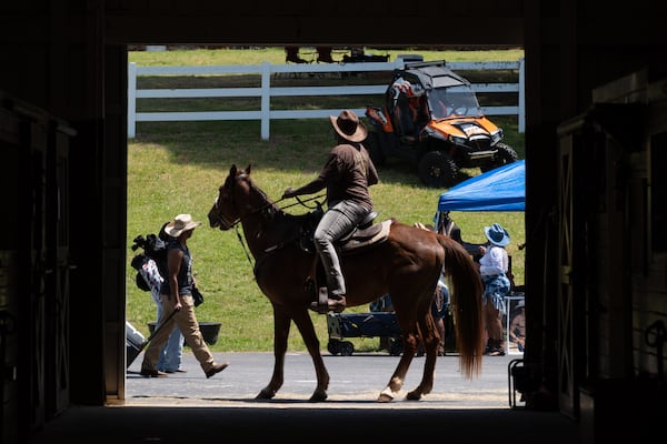 City Mungin, who owns The Outpost West in Winston, sits atop his horse Hennessy during a Cowboys and Creatives event Saturday, April 19, 2025. (Ben Gray for The Atlanta Journal-Constitution)