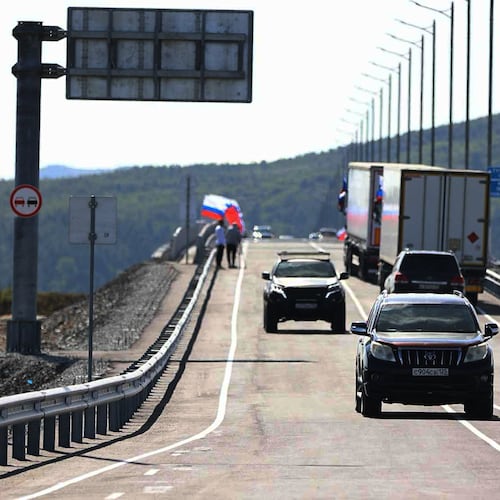 In this photo released by the Government of Primorsky Krai Region on Monday, Sept. 7, 2026, vehicles drive across the new bridge between Russia and North Korea named after the Soviet officer Yakov Novichenko, who is credited with saving North Korea's founding leader, Kim Il-sung, over the Tumannaya River in Primorsky Krai Region of Russia. (Dmitry Ignatenko/Government of Primorsky Krai Region via AP)