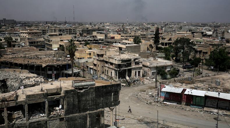 In this May 5, 2017 file photo, destroyed buildings from fighting between Iraqi forces and the Islamic State group are seen in western Mosul. (AP Photo/Bram Janssen, File)