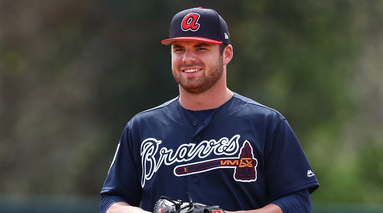 Atlanta Braves pitcher Bryse Wilson is all smiles participating in drills during the first full squad workout at spring training in the ESPN Wide World of Sports Complex on Thursday, Feb. 21, 2019, in Lake Buena Vista. Curtis Compton/ccompton@ajc.com