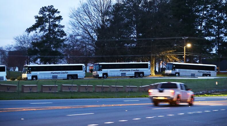 March 10, 2020 Marietta: A row of buses sit inside Dobbins Air Reserve Base off South Cobb Drive waiting on as many as 200 passengers from the Grand Princess cruise ship off the coast of California where more than 20 passengers have tested positive for a new strain of coronavirus on Tuesday, March 10, 2020, in Marietta. Curtis Compton ccompton@ajc.com
