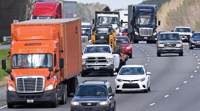 Cherokee County will spend up to $375,000 a year having six independent trucking companies do hauling for the Public Works Division. AJC FILE