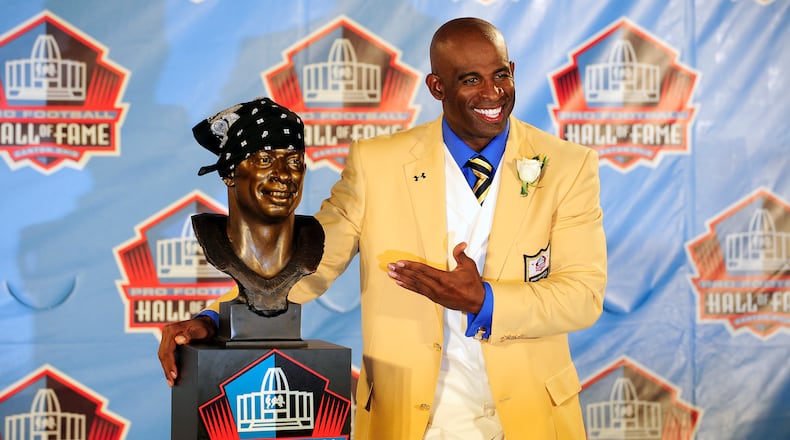 CANTON, OH - AUGUST 6: Former Atlanta Falcons and Florida State cornerback Deion Sanders poses with his bust at the Enshrinement Ceremony for the Pro Football Hall of Fame on August 6, 2011 in Canton, Ohio. (Photo by Jason Miller/Getty Images)
