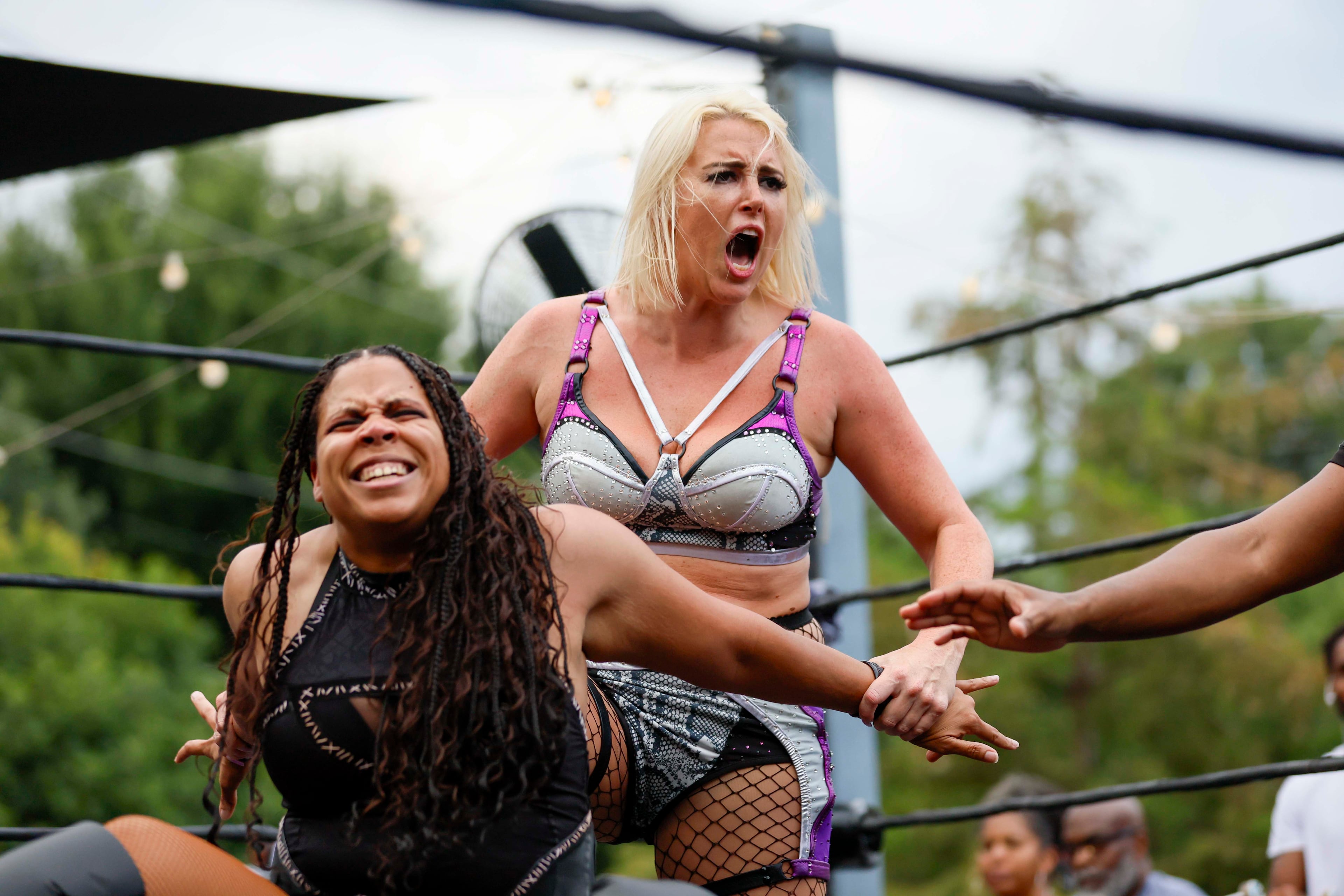 Fighters Gemma Jewels applies a lock to Savannah Evans during a wrestling match at New Realm Brewing on Sunday, August 31, 2025, in Atlanta. (Miguel Martinez/AJC)