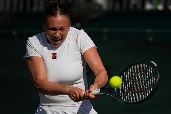 Amanda Anisimova of the U.S. returns the ball to Renata Zarazua of Mexico during their second round women's singles match at the Wimbledon Tennis Championships in London, Wednesday, July 2, 2025.(AP Photo/Kin Cheung)