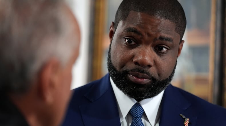 Florida Republican congressman and gubernatorial candidate Byron Donalds talks with a member of the Hispanic Police Officers Association in Doral, Fla., after receiving the group's endorsement, Thursday, Aug. 6, 2026. (AP Photo/Rebecca Blackwell)