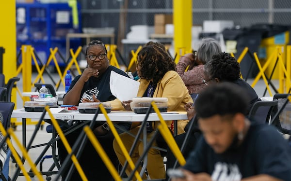 Election workers wait for ballots to arrive at the Fulton County Election Center during the 2026 Georgia primary elections. (Bob Andres for the AJC)