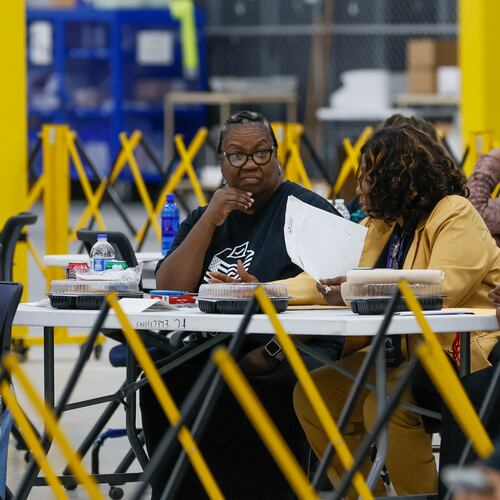 Election workers wait for ballots to arrive at the Fulton County Election Center during the 2026 Georgia primary elections. (Bob Andres for the AJC)