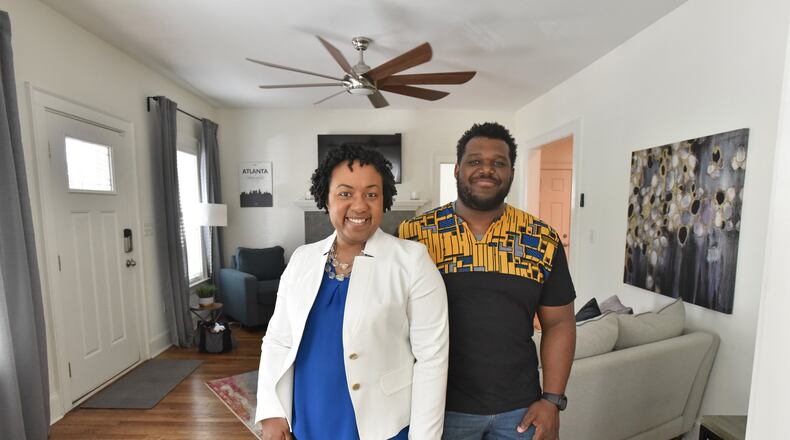 April 11, 2019 Atlanta - Portrait of Justin and Charalaina Heard at home in the Edgewood neighborhood. Last May, when the couple decided to lease their bungalow as an Airbnb site. HYOSUB SHIN / HSHIN@AJC.COM