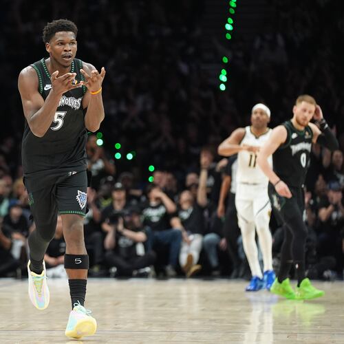 Minnesota Timberwolves guard Anthony Edwards (5) celebrates after making a 3-point shot during the first half in Game 3 of a first-round NBA basketball playoff series against the Denver Nuggets, Thursday, April 23, 2026, in Minneapolis. (AP Photo/Abbie Parr)