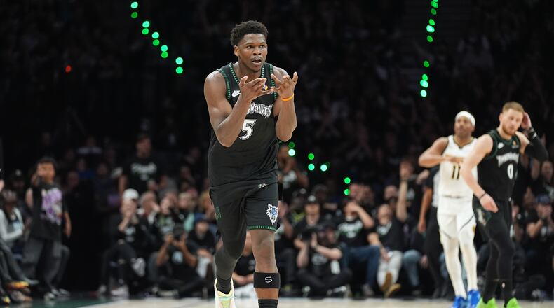 Minnesota Timberwolves guard Anthony Edwards (5) celebrates after making a 3-point shot during the first half in Game 3 of a first-round NBA basketball playoff series against the Denver Nuggets, Thursday, April 23, 2026, in Minneapolis. (AP Photo/Abbie Parr)