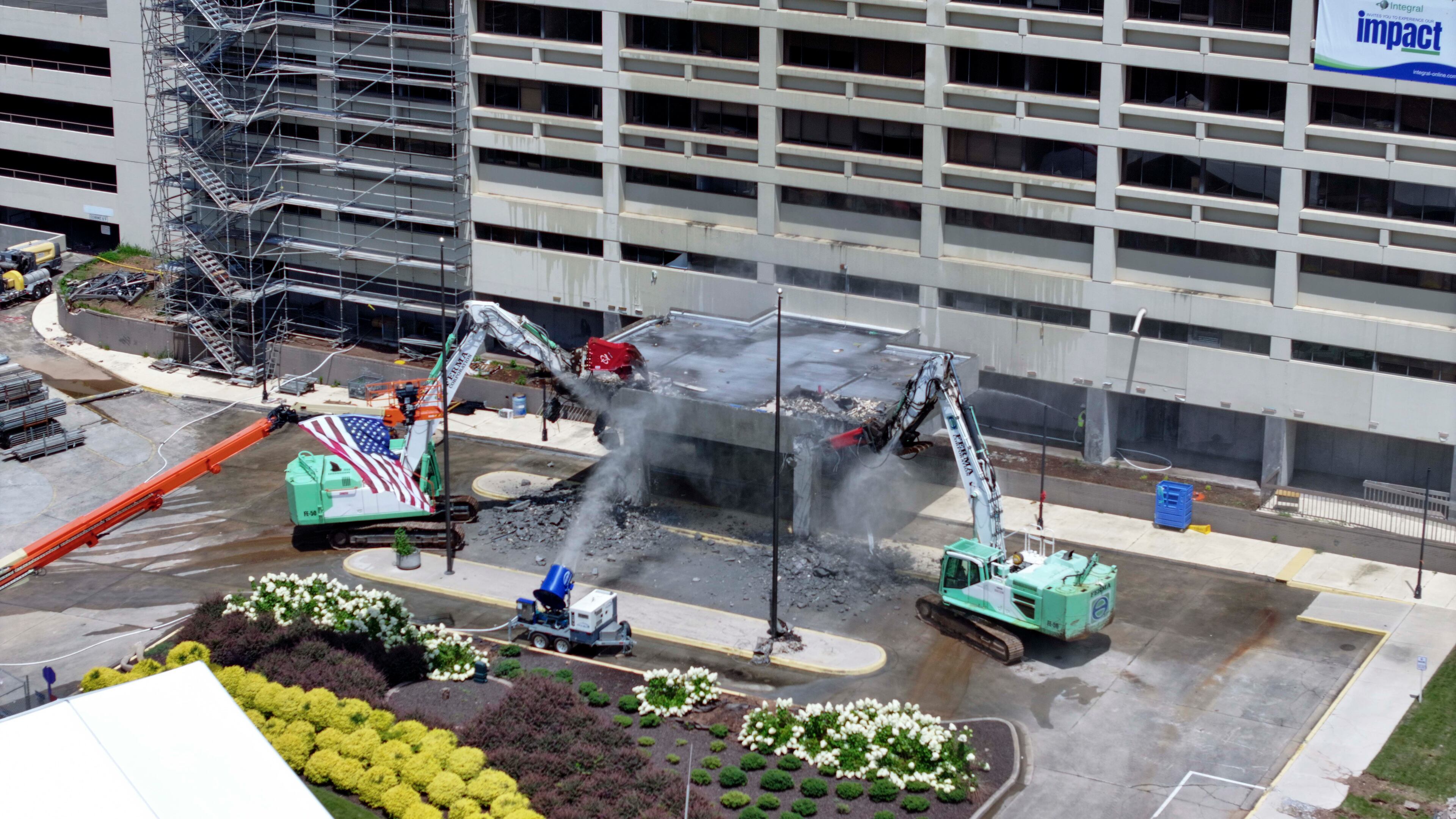 Heavy machinery is visible at the start of the demolition of the former Atlanta Medical Center on Monday, June 30, 2025. The AMC served the surrounding communities for over a century. (Miguel Martinez/AJC)