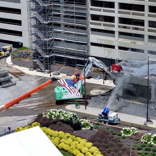 Heavy machinery is visible at the start of the demolition of the former Atlanta Medical Center on Monday, June 30, 2025. The AMC served the surrounding communities for over a century. (Miguel Martinez/AJC)