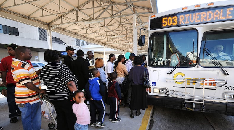 C-Tran riders line up at Hartsfield-Jackson International Airport to board the Clayton bus service to Riverdale on its last day of operation in March 2010. Credit Johnny Crawford AJC