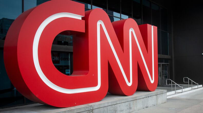 FILE - The CNN logo is displayed at the entrance to the CNN Center in Atlanta on Feb. 2, 2022. (AP Photo/Ron Harris, File)