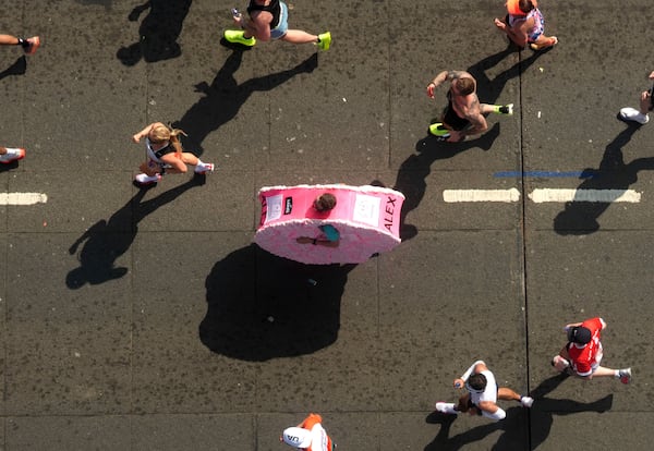 A general view from inside the viewing window above Tower Bridge of the mass participation race during the TCS London Marathon, Sunday April 27, 2025. (Jonathan Brady/PA via AP)
