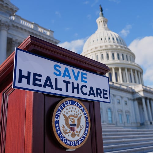 A podium is prepared before Democrats hold news conference on the health care funding fight on the steps of the House before votes to end the government shutdown, on Capitol Hill, Wednesday, Nov. 12, 2025, in Washington. (AP Photo/Mariam Zuhaib)