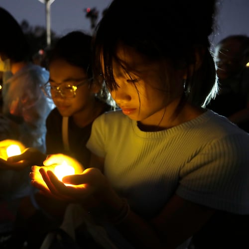 Participants attend a candlelight vigil at Democracy Square to mark the 37th anniversary of the Chinese military crackdown on the pro-democracy movement in Beijing's Tiananmen Square, in Taipei, Taiwan, Thursday, June 4, 2026. (AP Photo/Chiang Ying-ying)