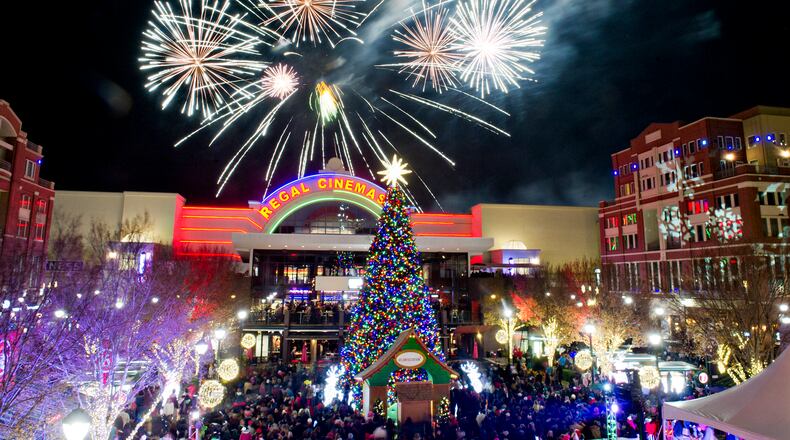 November 23, 2013 Atlanta - Fireworks go off above the tree at Atlantic Station in Atlanta during the annual Christmas tree lighting as thousands of people watch the show on Saturday, November 23, 2013. The all-day celebration had live music, arts, live reindeer, delicious winter treats, and activities for the whole family. JONATHAN PHILLIPS / SPECIAL