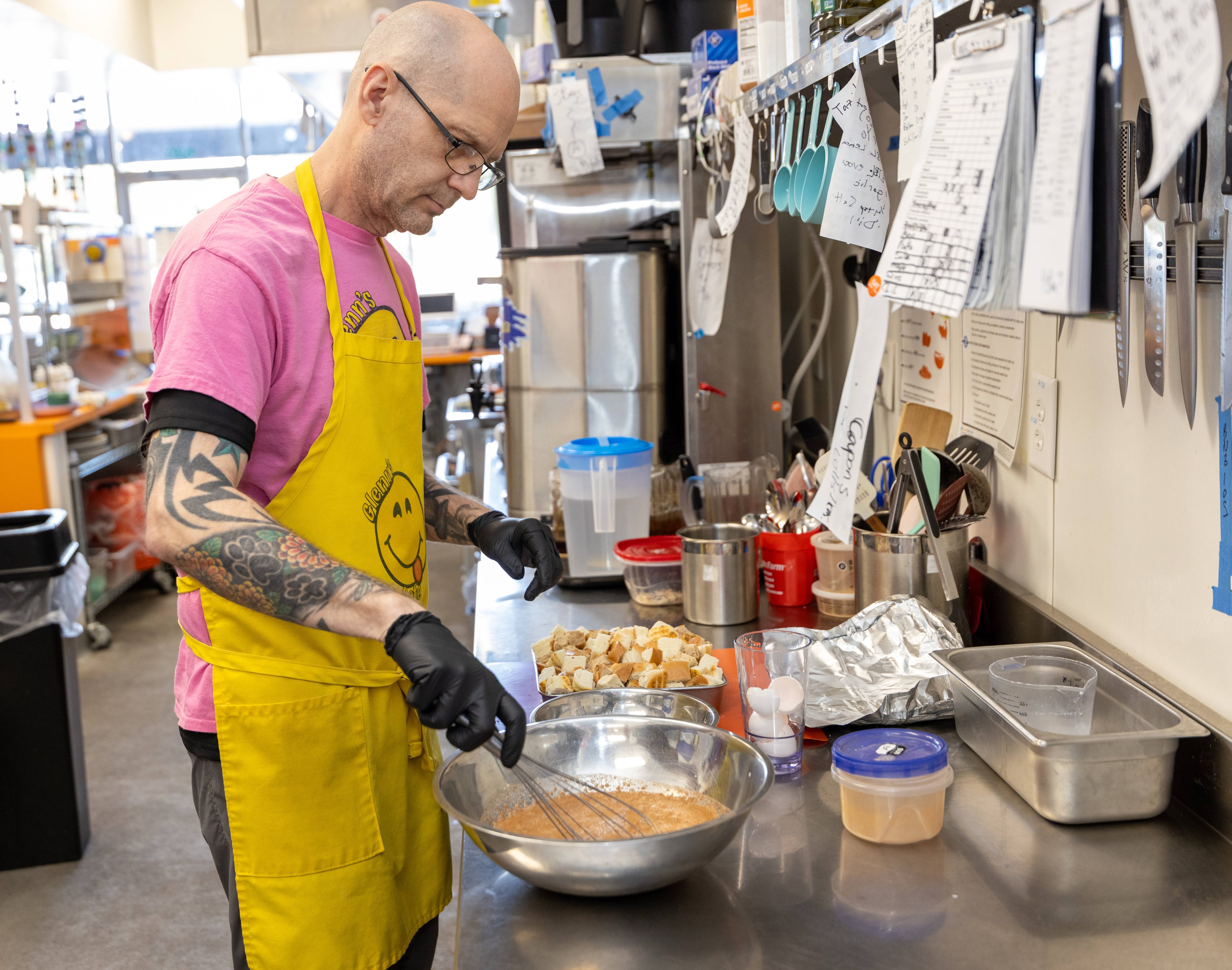 Jason Walsh prepares bread pudding at Glenn's Cafe. (Phil Skinner for the AJC)