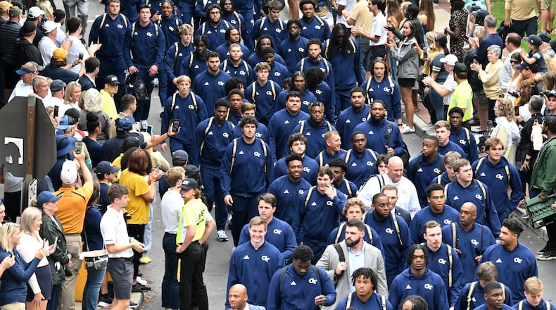 September 9, 2022 Atlanta - Georgia Tech football players walk Yellow Jacket Alley as they arrive for an NCAA college football game against Western Carolina outside Georgia Tech's Bobby Dodd Stadium in Atlanta on Saturday, September 10, 2022. (Hyosub Shin / Hyosub.Shin@ajc.com)