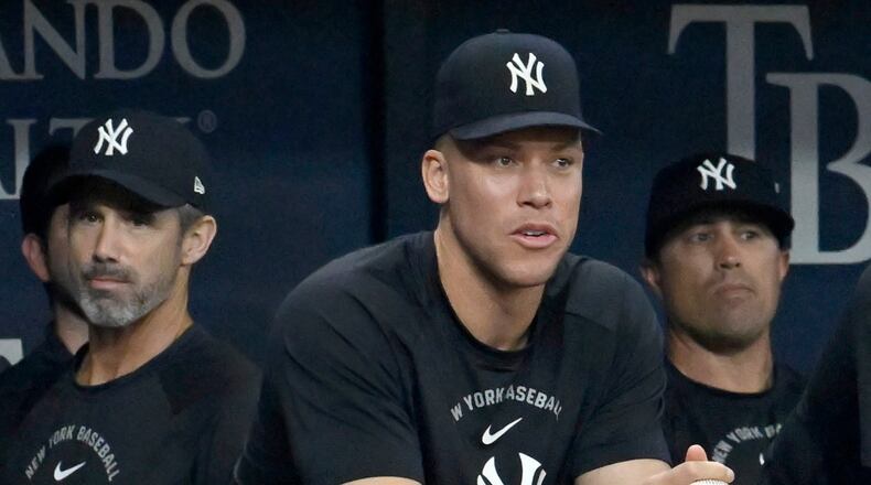 New York Yankees' Aaron Judge watches from the dugout during a baseball game against the Tampa Bay Rays Monday, July 6, 2026, in St. Petersburg, Fla. (AP Photo/Jason Behnken)