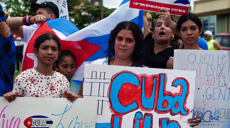 Protesters gathered in Sandy Springs on Sunday, July 18th, 2021, in a show of solidarity for Cuba.
