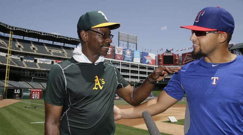 New Braves third-base coach Ron Washington was an Oakland coach when he was greeted warmly by Rougned Odor of the Texas Rangers, the team Washington previously managed. (AP file photo)