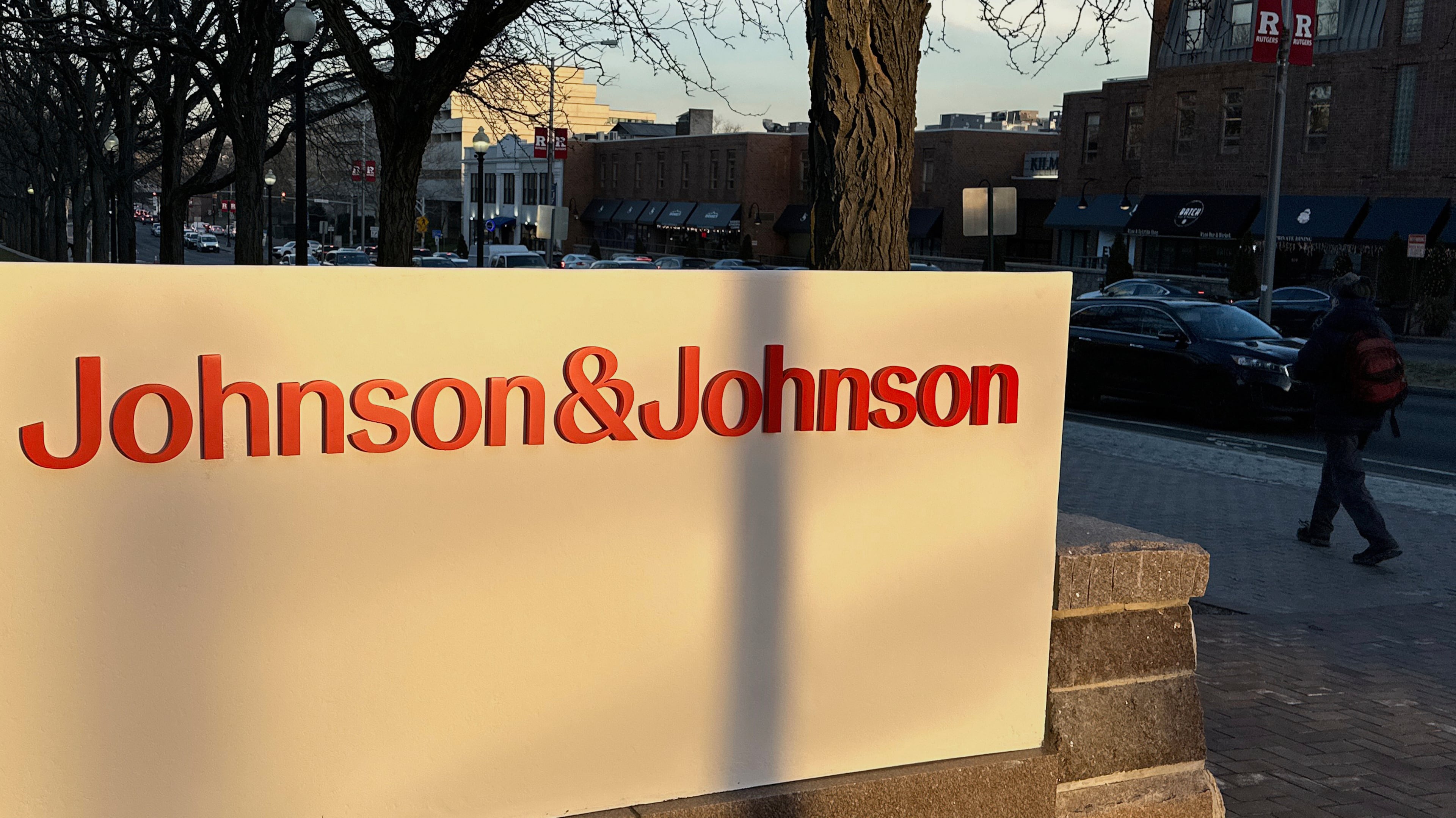 FILE - A person walks by the Johnson & Johnson headquarters is in New Brunswick, N.J., on Feb. 8, 2024. (AP Photo/Ted Shaffrey, File)