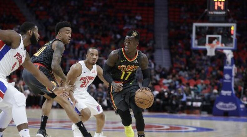 Hawks guard Dennis Schroder drives to the basket against the Pistons on Friday night in Detroit.
