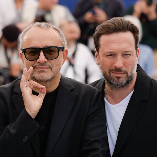 Iris Lebedeva, director Andrey Zvyagintsev and Dmitriy Mazurov pose for photographers at the photo call for the film Minotaur' at the 79th international film festival, Cannes, southern France, Wednesday, May 20, 2026. (Photo by Millie Turner/Invision/AP)
