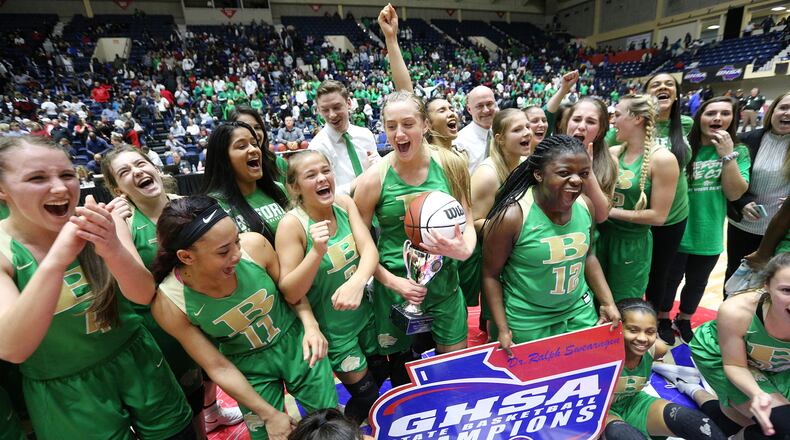 Buford gathers for their team photo and trophy presentation after winning the GHSA state basketball championship game on Thursday, March 8, 2018, in Macon.