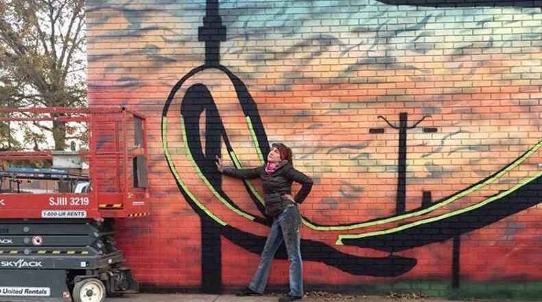 The Sugar Hill Arts Commission is seeking artwork for a juried show. Here, ‘The Sweet Life’ mural artist Jennie Osiek. Courtesy City of Sugar Hill