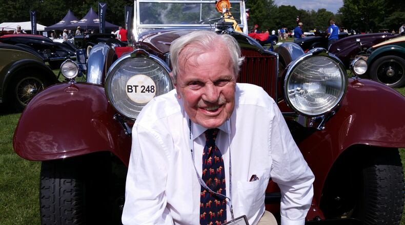 Don Peterson was editor and owner of Car Collector magazine, an expert appraiser of classic cars, and a board member of the Classic Car Club of America in front of his  burgundy 1930 Packard 734 Speedster, only six of which still exist.