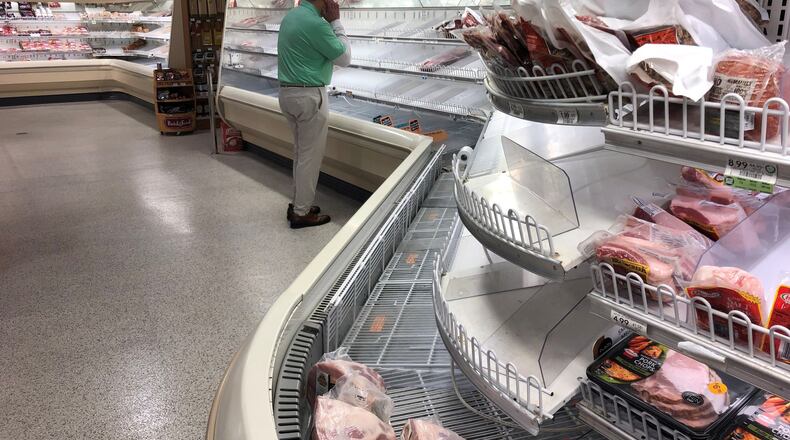 The shortages in meat have been a combination of spiking shopper demand and shutdowns of some Midwestern plants hit by outbreaks of the coronavirus. Here, a Publix in Cobb County with a shortage of fresh beef and chicken. (AJC file photo)