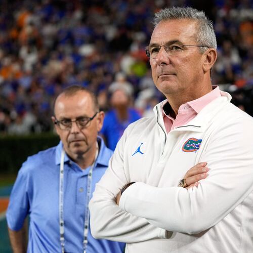 FILE - Former Florida head coach Urban Meyer watches the first half of an NCAA college football game between Florida and Tennessee, Saturday, Nov. 22, 2025, in Gainesville, Fla. (AP Photo/John Raoux, File)