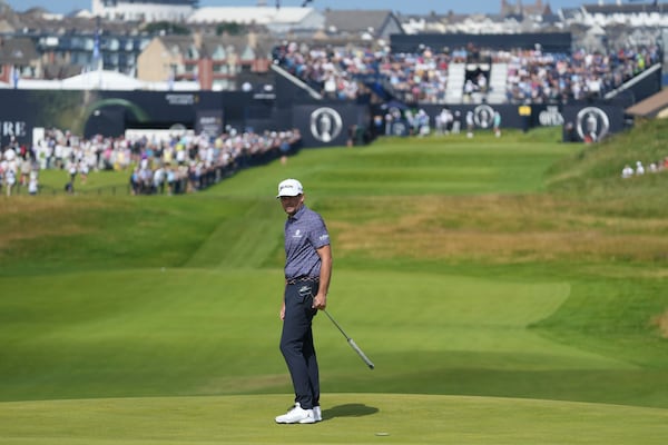 Keegan Bradley of the United States walks on the 1st green during a practice round for the British Open golf championship at the Royal Portrush Golf Club, Northern Ireland, Wednesday, July 16, 2025. (AP Photo/Jon Super)