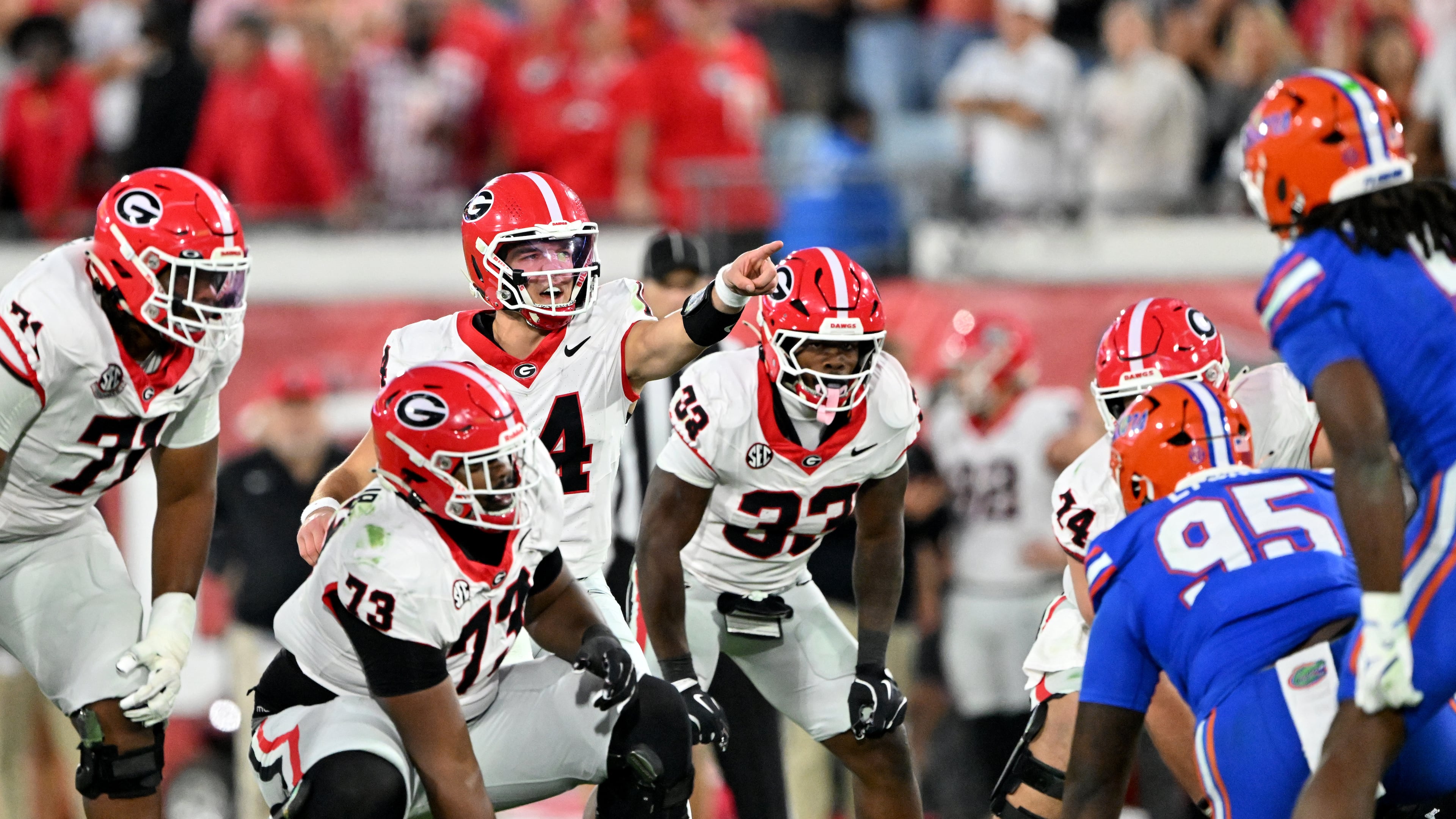Georgia stayed in No. 5 in the AP rankings after beating Florida on Saturday. The first College Football Playoff rankings of the season will be announced on Tuesday night. (Hyosub Shin/AJC)