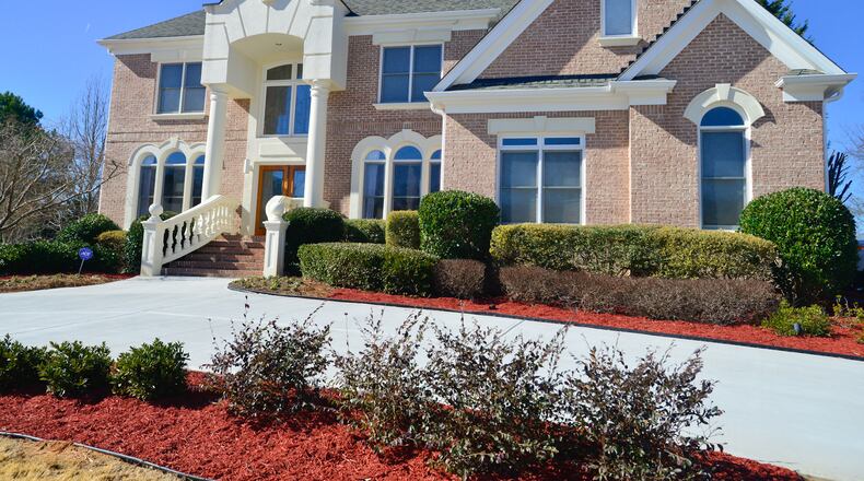 State Rep. Billy Mitchell and his wife, Shawn Evans Mitchell, purchased their home near Lithonia as a foreclosure in 2012. Residential real estate assessments rose 40 percent in Lithonia this year.