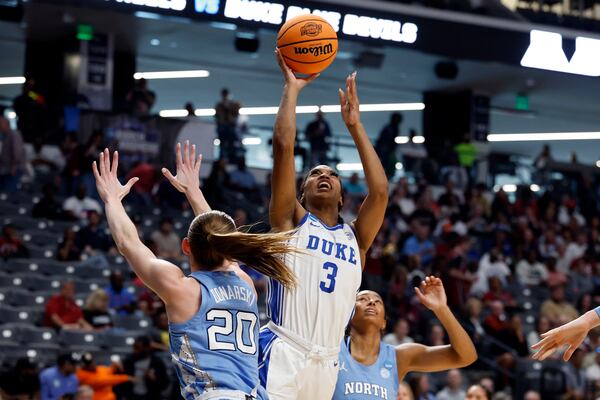 Duke guard Ashlon Jackson (3) puts up a shot over North Carolina guard Lexi Donarski (20) during the first half in the Sweet 16 of the NCAA college basketball tournament, Friday, March 28, 2025, in Birmingham, Ala. (AP Photo/Butch Dill)