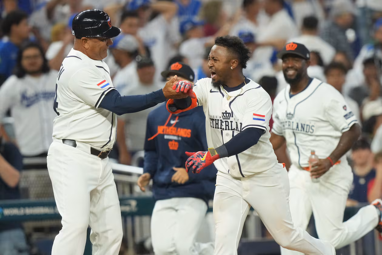 The Netherlands’ Ozzie Albies (right) celebrates his three-run home run with third base coach Ben Thijssen during the ninth inning of a World Baseball Classic game against Nicaragua on Saturday, March 7, 2026, in Miami. (Marta Lavandier/AP)