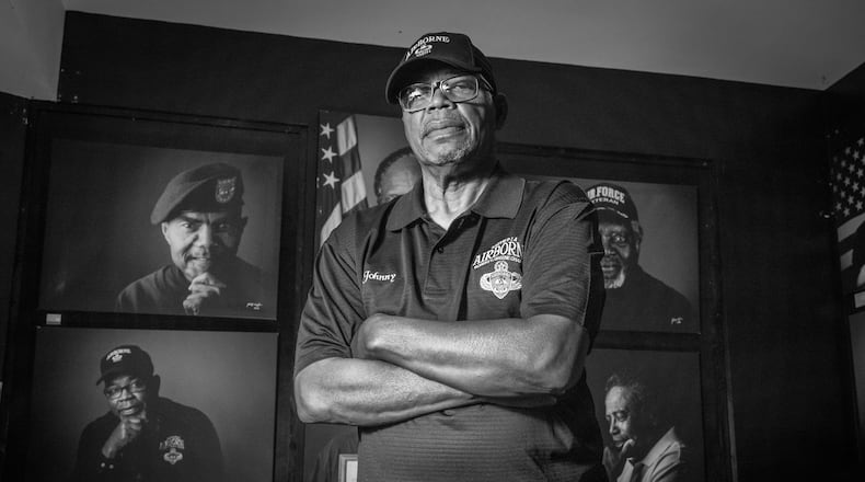 Vietnam Veteran Sgt. Johnny Miller stands in front of a series of portraits of Black Vietnam War veterans now on display at the Marietta History Center Tuesday, June 27, 2023. (Steve Schaefer/steve.schaefer@ajc.com)
