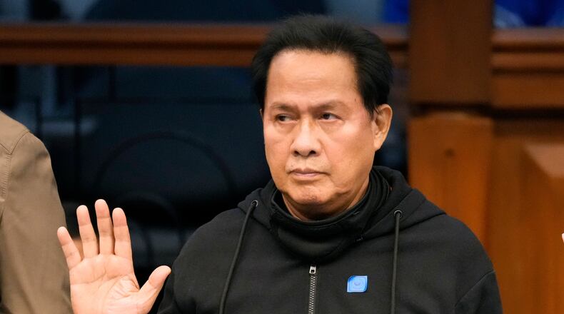 FILE - Apollo Quiboloy takes his oath as he attends a hearing at the Philippine Senate on Oct. 23, 2024, in Manila, Philippines. (AP Photo/Aaron Favila, File)