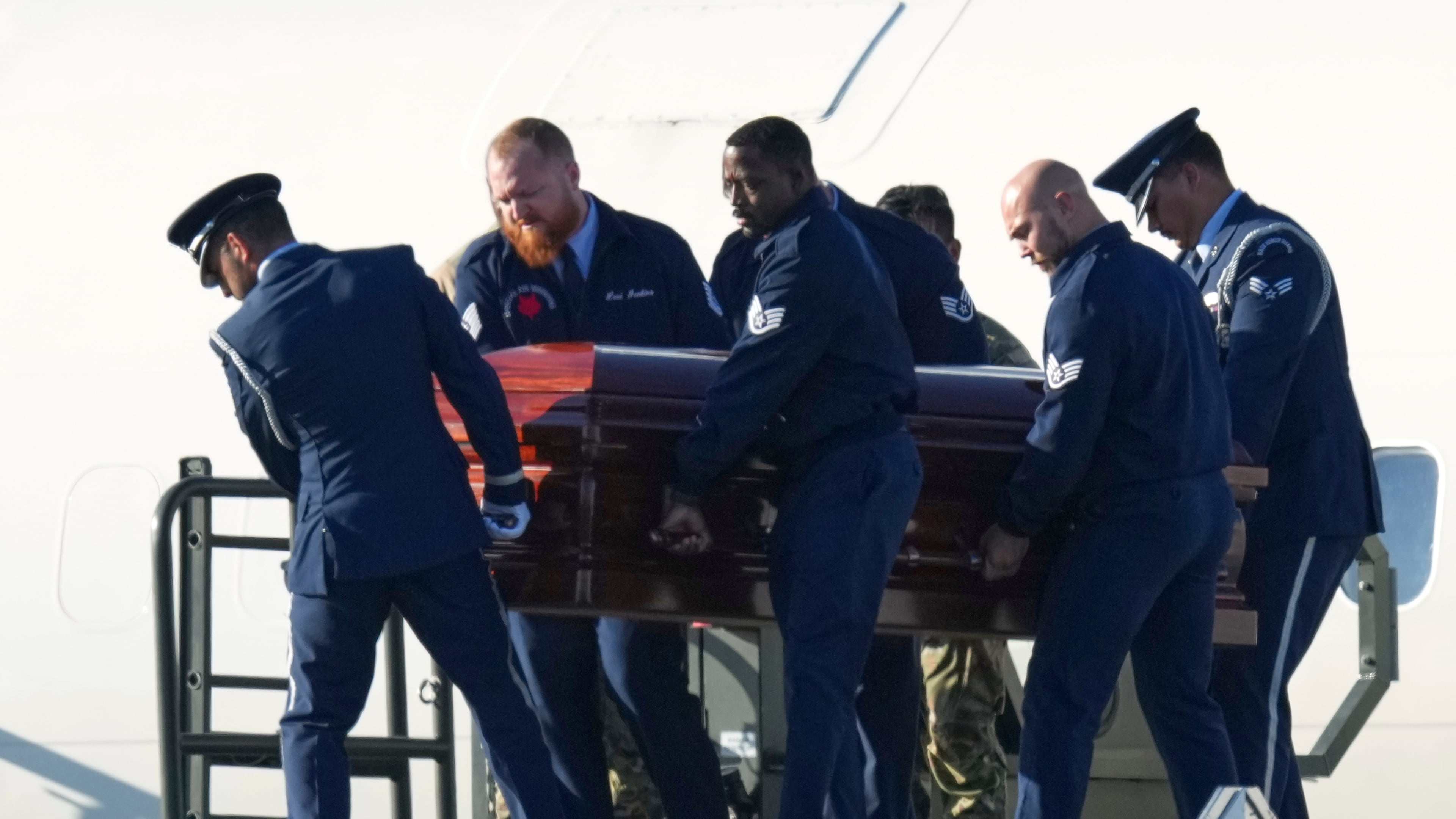 The casket containing the body of Charlie Kirk, the CEO and co-founder of Turning Point USA who was shot and killed on Wednesday is removed from Air Force Two at Phoenix Sky Harbor International Airport, Thursday, Sept. 11, 2025, in Phoenix. (AP Photo/Ross D. Franklin)