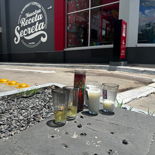 Candles sit near the spot where César Gastélum, a social media influencer, was killed the previous night in Culiacán, Mexico, Wednesday, Aug. 5, 2026. (AP Photo/Aaron Ibarra)
