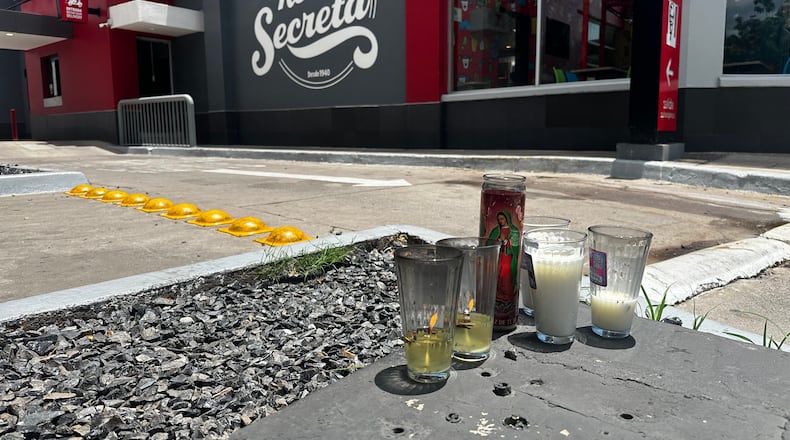 Candles sit near the spot where César Gastélum, a social media influencer, was killed the previous night in Culiacán, Mexico, Wednesday, Aug. 5, 2026. (AP Photo/Aaron Ibarra)