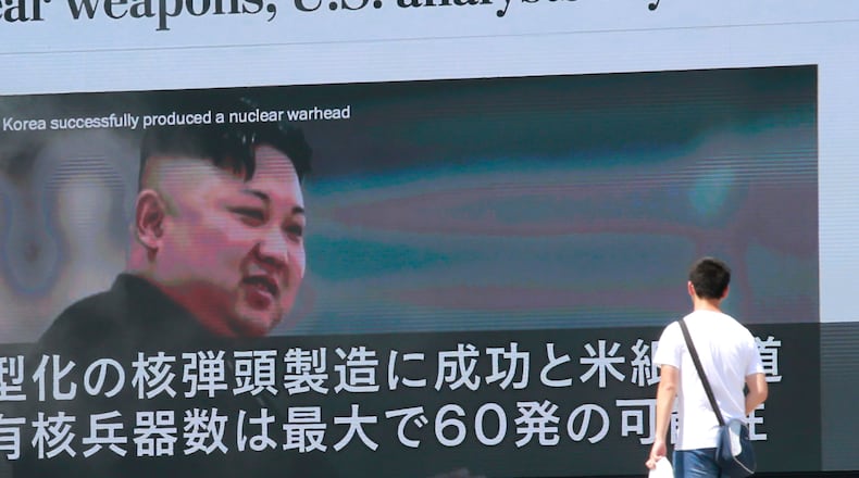 A man walks by a TV news program showing an image of North Korean leader Kim Jong Un in Tokyo on Wednesday. AP/Shizuo Kambayashi