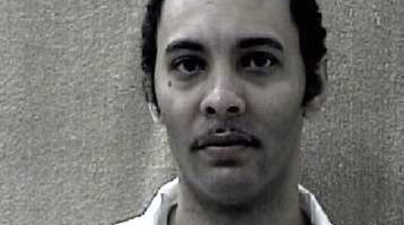 Clifford Bernard Neal is suspected of injuring a Villa Rica police officer as he fled a Carroll County Wal-Mart Thursday night. (Credit: Georgia Department of Corrections)