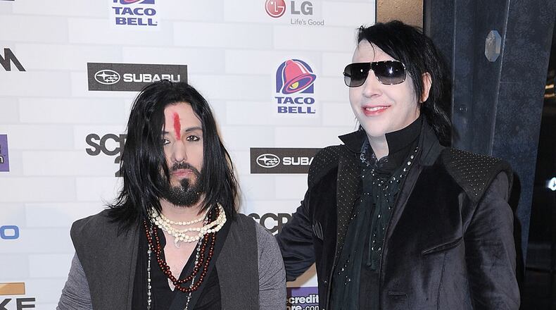 Marilyn Manson has said he is no longer working with his bassist, Twiggy Ramirez (L). Ramirez was accused of rape by musician Jessicka Addams.