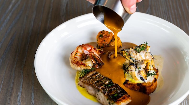 The Aix Bouillabaisse is made with a variety of seafood, but what’s really special is the saffron-tinged broth. CONTRIBUTED BY HENRI HOLLIS